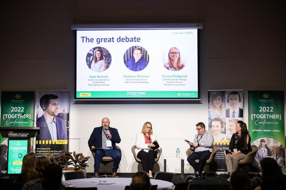 Michael Clark moderating The Great Debate panel at Auscontact 2022